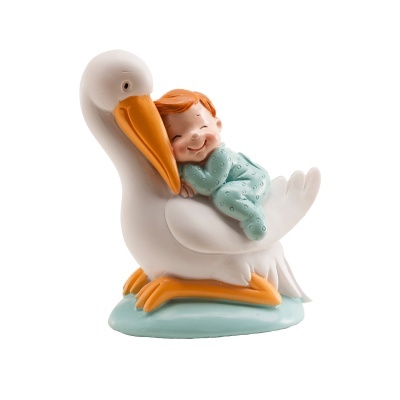 Figura decorativa de bebé a dormir junto a cegonha branca e laranja