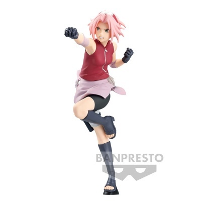 Figura anime de personagem com cabelos rosa e roupa vermelha e rosa em posição de luta.