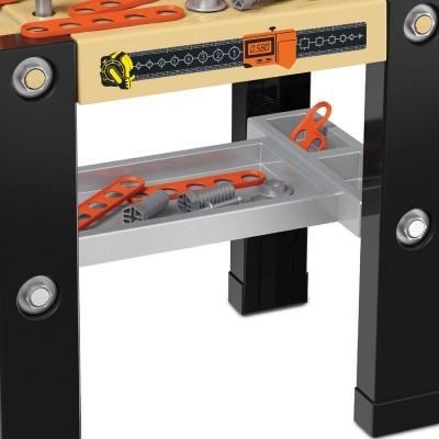 Bancada de trabalho infantil preta, cinzenta e laranja com parafusos de plástico cinza e régua com visor digital.