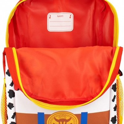 Mochila infantil aberta com padrão de vaca e cores vivas