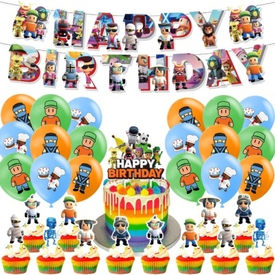 Decoração colorida de festa de aniversário com balões, faixa, bolo e cupcakes com personagens desenhados.