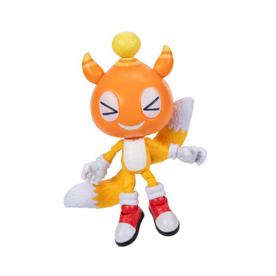 Figura de ação laranja com olhos grandes e ténis vermelhos