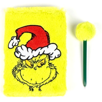 Caderno felpudo amarelo com imagem do Grinch e caneta com pompom amarelo.
