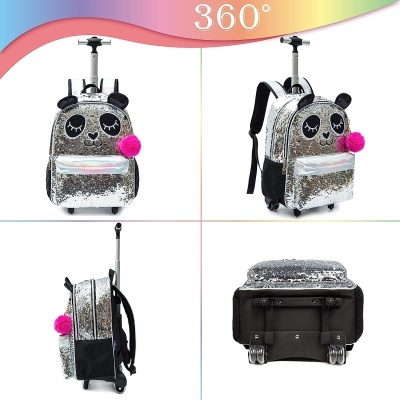 Mochila de criança prateada com rodas, olhos desenhados e pompom rosa