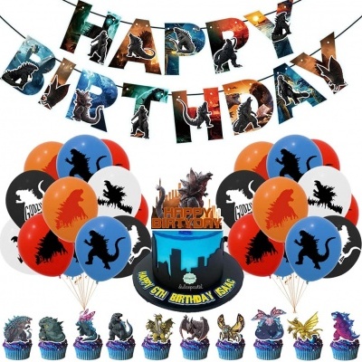 Decoração de festa de aniversário com tema Godzilla incluindo balões, bandeirola, bolo e cupcakes decorados com monstros.