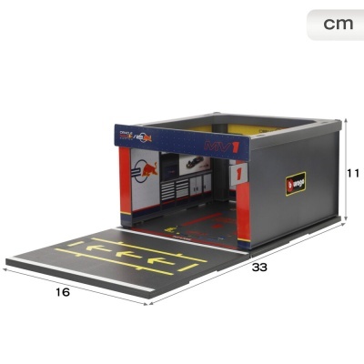 Garagem de brinquedo preta e vermelha com logótipos Red Bull e Oracle
