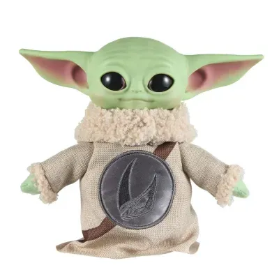 Boneco de peluche com vestido bege e orelhas grandes verdes