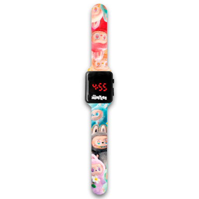 Relógio digital com bracelete colorida com desenhos de monstros e ecrã preto com números vermelhos