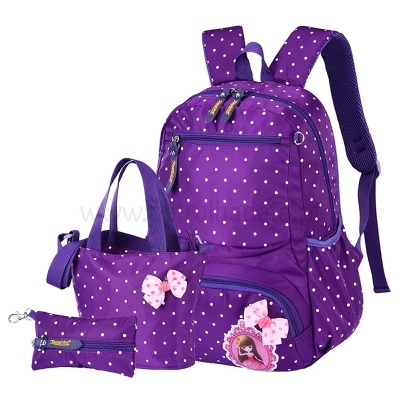Conjunto roxo de mochila, bolsa, carteira e estojo com pontos brancos e laços cor-de-rosa