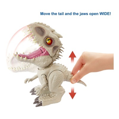 Brinquedo dinossauro cinzento a abrir a boca com texto azul