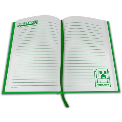 Caderno aberto verde com páginas de linhas e design Minecraft