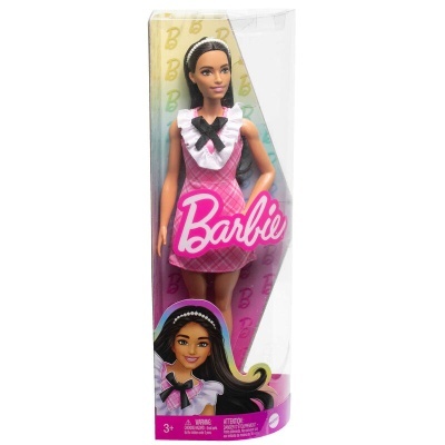 Boneca Barbie vestida de rosa numa embalagem transparente com texto rosa