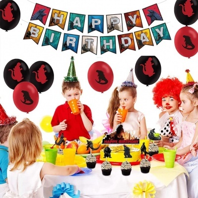 Festa de aniversário infantil com decoração de dinossauros e bolo decorado