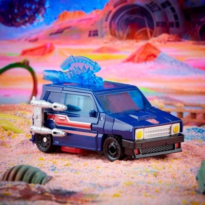 Miniatura de veículo azul com armas e acessórios, cenário extraterrestre colorido