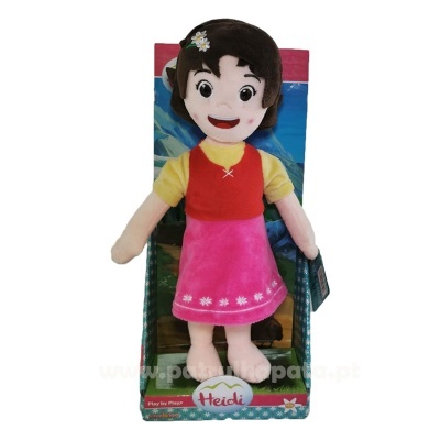 Boneca de pelúcia Heidi com vestido cor de rosa e blusa amarela em embalagem colorida