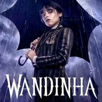 Jovem com guarda-chuva preto na chuva, casaco risca de giz, texto WANDINHA