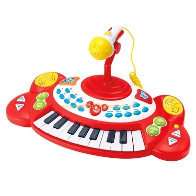 Instrumento musical de brinquedo colorido com teclas de piano e microfone