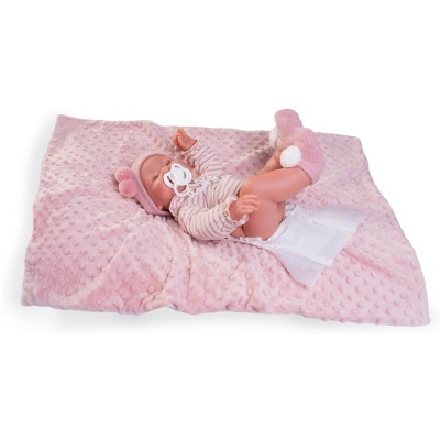Boneca bebé realista deitada em manta rosa com chupeta e roupa rosa