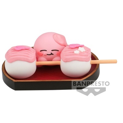 Figura decorativa de polvo rosa com bolas brancas e creme rosa sobre base negra e vermelha