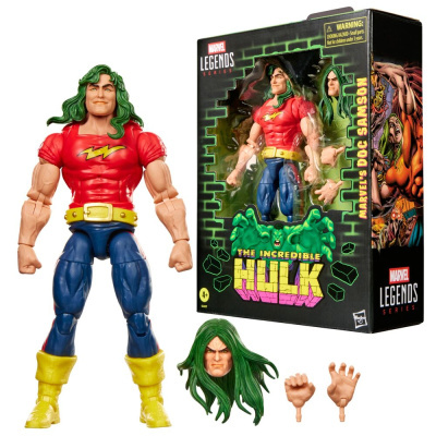 Boneco de ação Marvel do Doc Samson com roupa vermelha, azul e amarela, cabelo verde, acessórios intercambiáveis e embalagem preta com texto e desenho do Hulk.