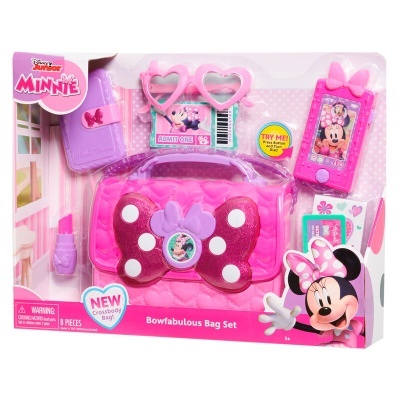 Conjunto de acessórios Bowfabulous da Minnie em embalagem com bolsa rosa, óculos, telemóvel, livro e batom.