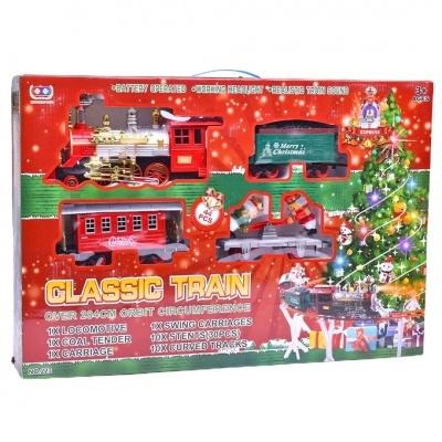 Conjunto de comboio clássico vermelho e verde em embalagem festiva com árvore de Natal