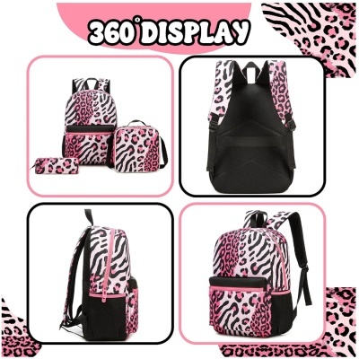 Conjunto mochila, saco de transporte e estojo com padrão animal print rosa e preto.