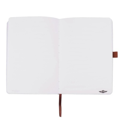 Caderno aberto branco com fita marcador e elástico