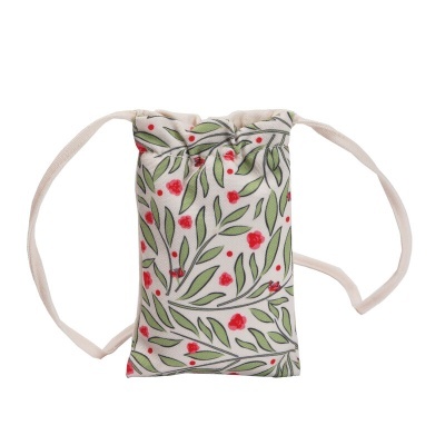 Saco pequeno de tecido com padrão botânico e cordões
