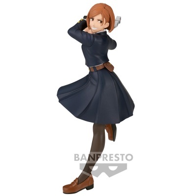 Figura colecionável feminina em vestido azul escuro em pose dinâmica.