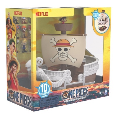 Brinquedo One Piece barco branco com vela de caveira, embalagem colorida com logo Netflix