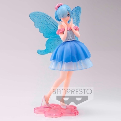 Figura de personagem feminina com vestido azul, asas azuis e base rosa em forma de flor