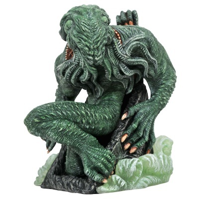 Figura decorativa do monstro Cthulhu verde com tentáculos e base com ondas.