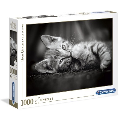 Caixa de puzzle com imagem de gato preto e branco deitado