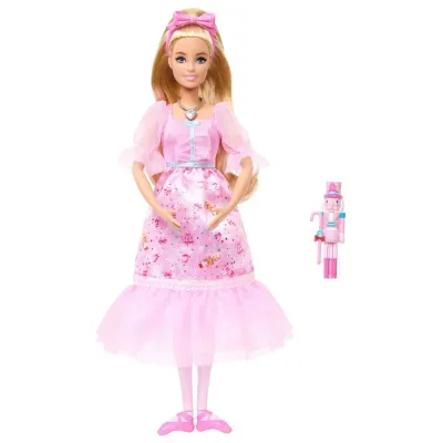 Boneca Barbie em vestido rosa com soldado de pau de canela rosa ao lado