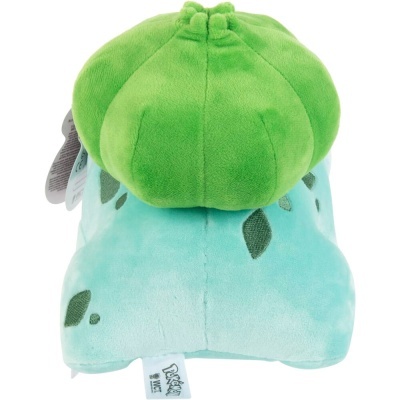 Pelúcia do Pokémon Bulbasaur azul claro e verde com etiqueta Pokémon