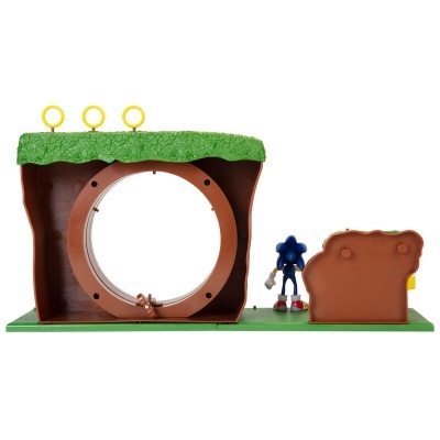 Brinquedo de pista com tema Sonic e figura do personagem em plástico, com anéis amarelos e base verde.