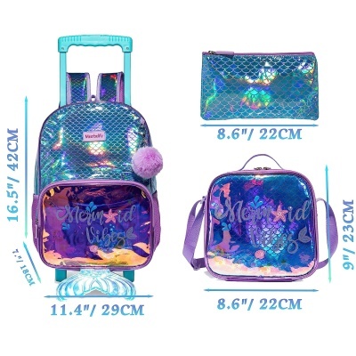 Mala, mochila e estojo holográficos azuis com padrão de escamas e texto 'Mermaid Vibes'.