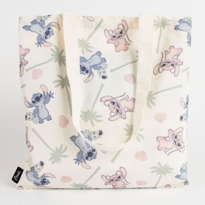 Saco de tecido com padrão de personagens cartoons azul e rosa e folhas verdes