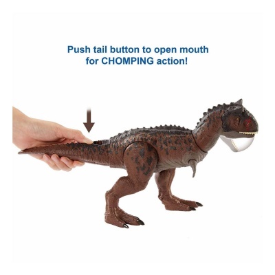 Brinquedo dinossauro castanho com manchas pretas e dentes brancos a abrir a boca