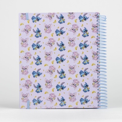 Caderno espiral lilás com personagens azuis e cor-de-rosa e bananas amarelas