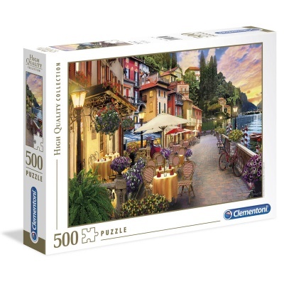 Puzzle de 500 peças com imagem de rua à beira de lago e café ao entardecer.