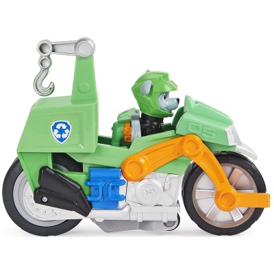 Motociclo de brinquedo verde com boneco canino a conduzir