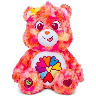 Urso de peluche colorido com padrão de corações no ventre