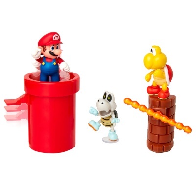 Brinquedos de Super Mario incluindo Mario num cano vermelho, um esqueleto e uma tartaruga com carapaça vermelha num bloco castanho.