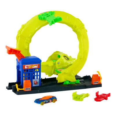Brinquedo Hot Wheels com anel amarelo e rosto de dinossauro, estação azul com rampa laranja, carro azul e bases verde e vermelha.