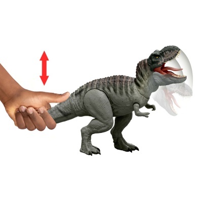 Brinquedo dinossauro cinzento com mão a mostrar movimento da cabeça