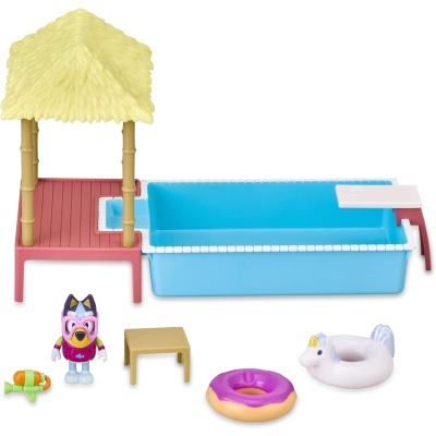 Conjunto de brinquedo com piscina azul, plataforma vermelha e cobertura amarela de palha, figura de animal e acessórios coloridos.