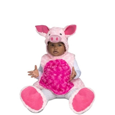 Bebé com fato de porco cor-de-rosa em peluche sentado