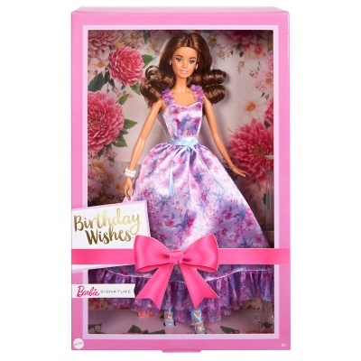 Boneca Barbie de vestido lilás floral na caixa rosa com laço
